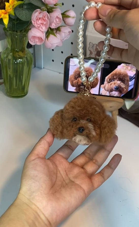 Custom felted poodle portrait charm beside reference photos