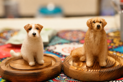 Two handcrafted mini full-body wool dog figurines