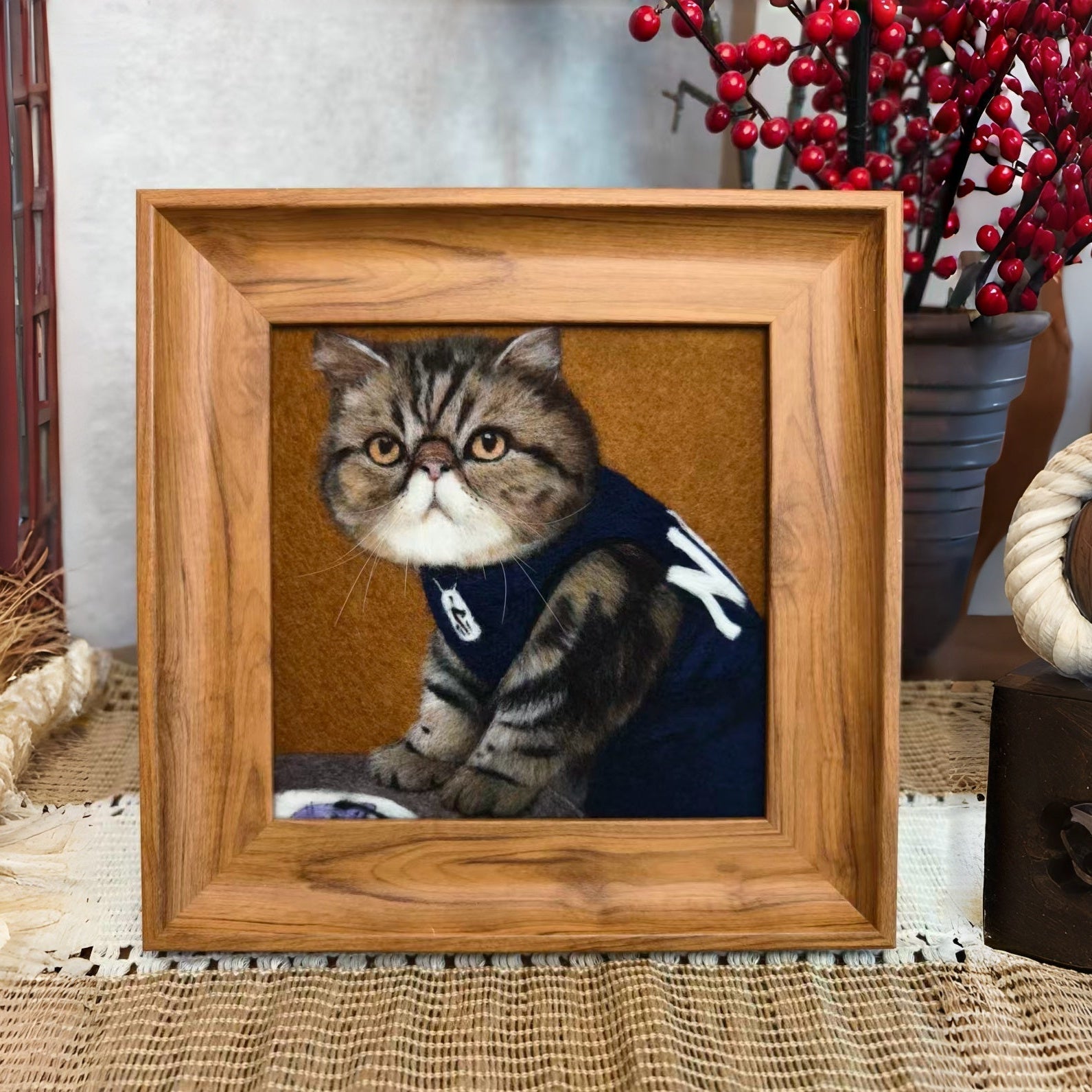Handcrafted wool-painted tabby cat portrait in a wooden frame